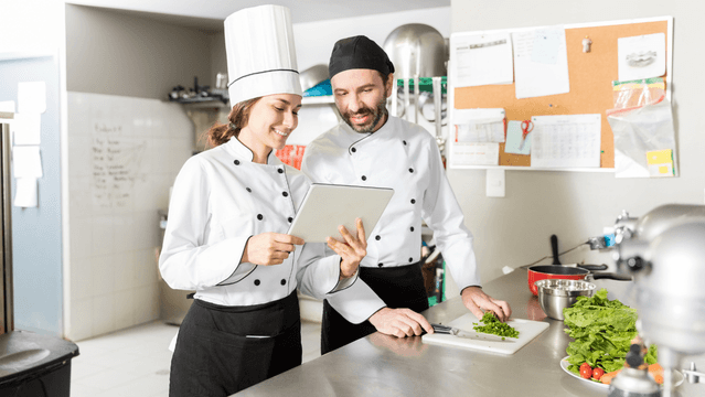 Kitchen staff using a food recall communication checklist