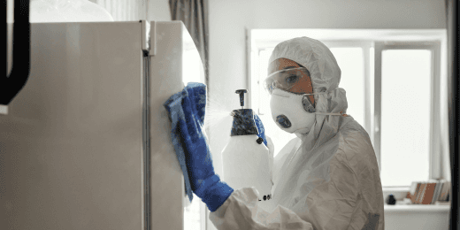 Food service staff cleaning and sanitizing equipment