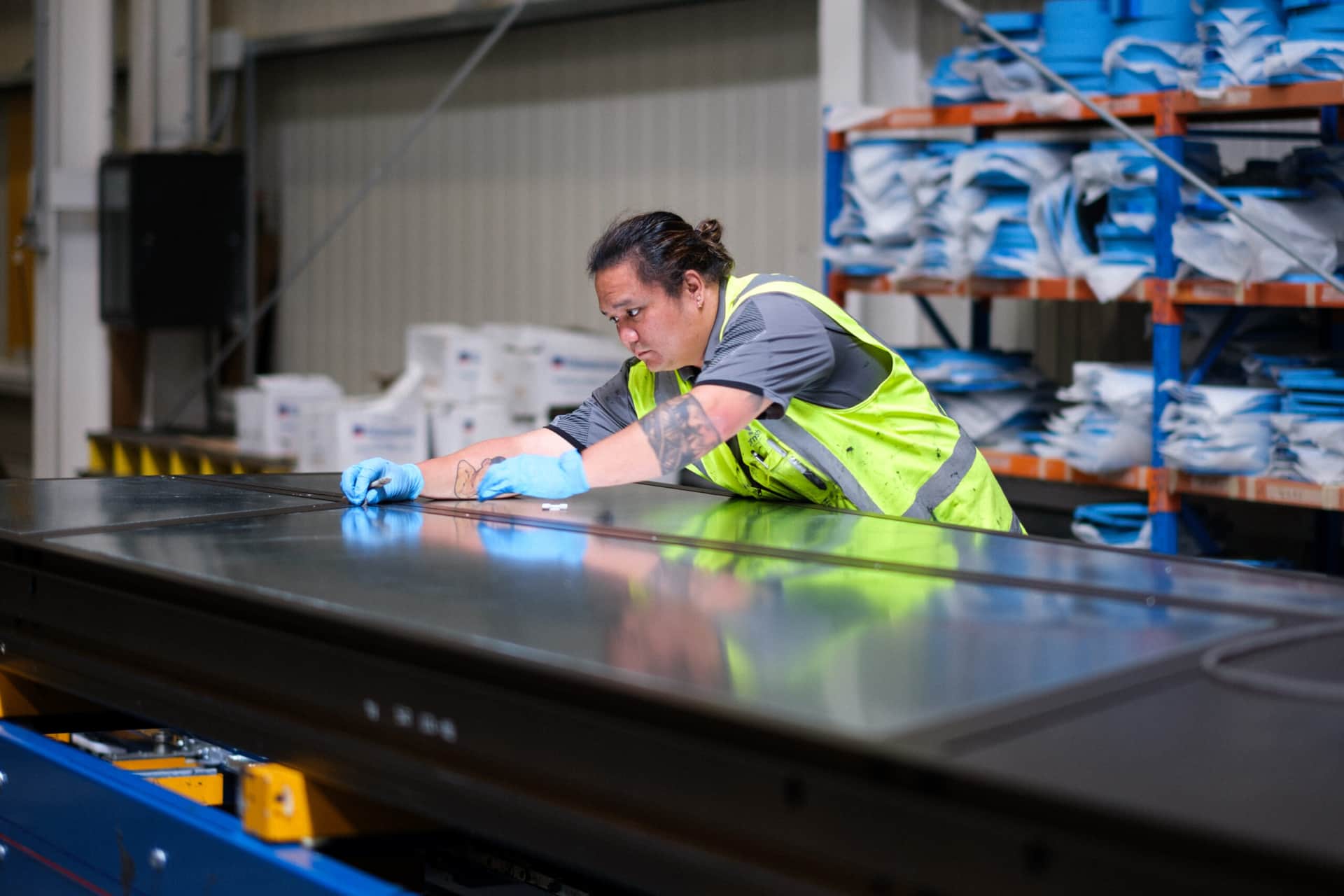Thermosash Group worker installing bespoke building envelope | Image included in SafetyCulture manufacturing, construction, and installation case study