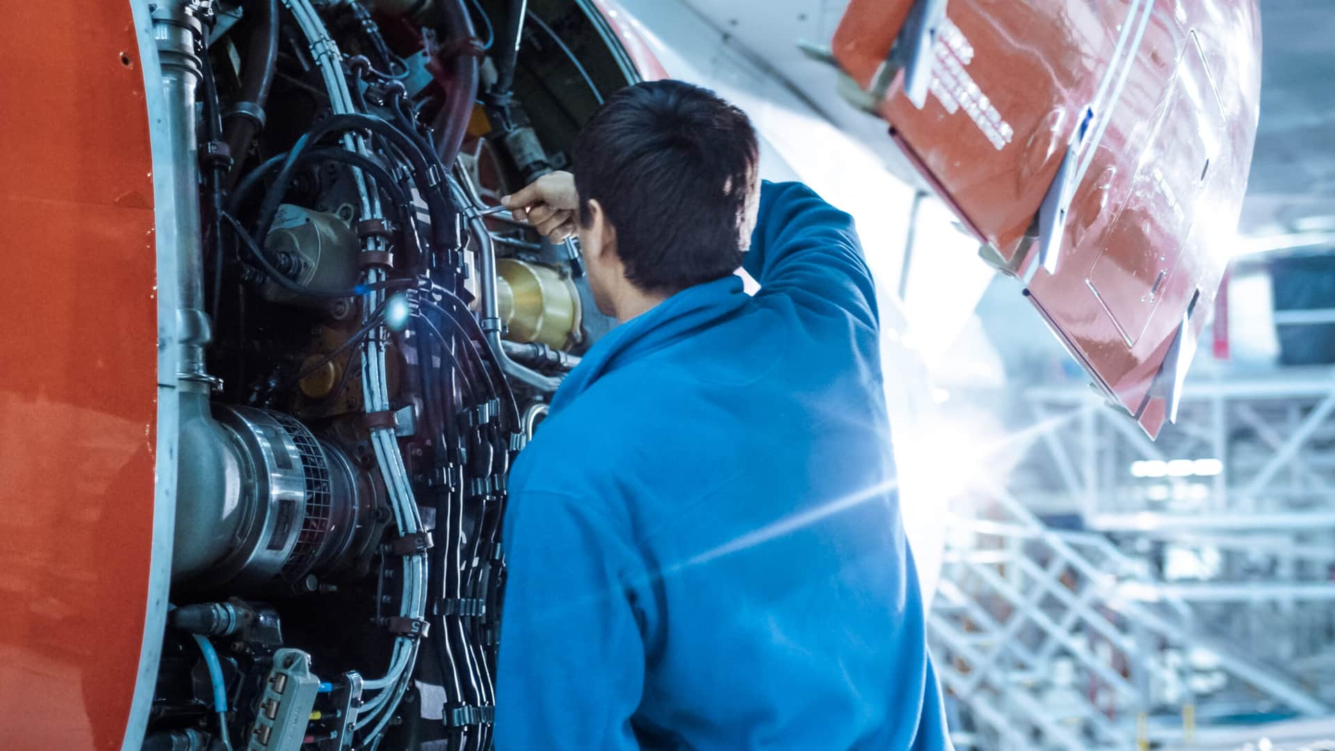 An aircraft mechanic doing airplane maintenance.