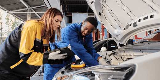 Workers performing autonomous vehicle maintenance