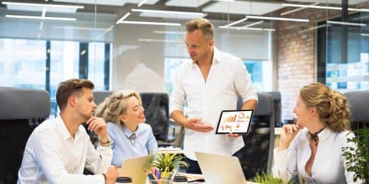 a group of organizational leaders discussing risk culture strategies in a meeting room