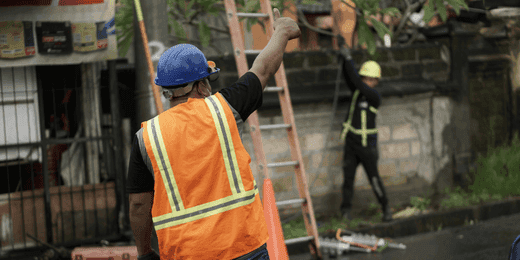 Workers implementing a disaster recovery policy during an emergency