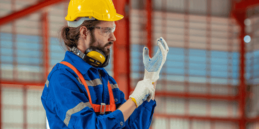 Worker using PPE during his ISO 45001 training